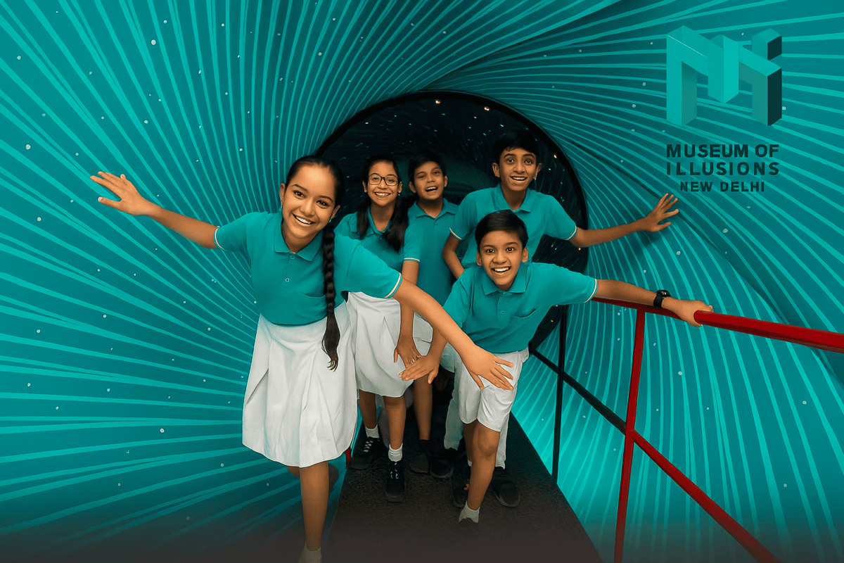 Indian school children wearing teal uniforms joyfully explore the Vortex Tunnel at the Museum of Illusions, New Delhi. The tunnel's teal and turquoise swirling pattern, matching the museum’s logo colors, creates an immersive illusion experience as the students laugh and lean while walking through.